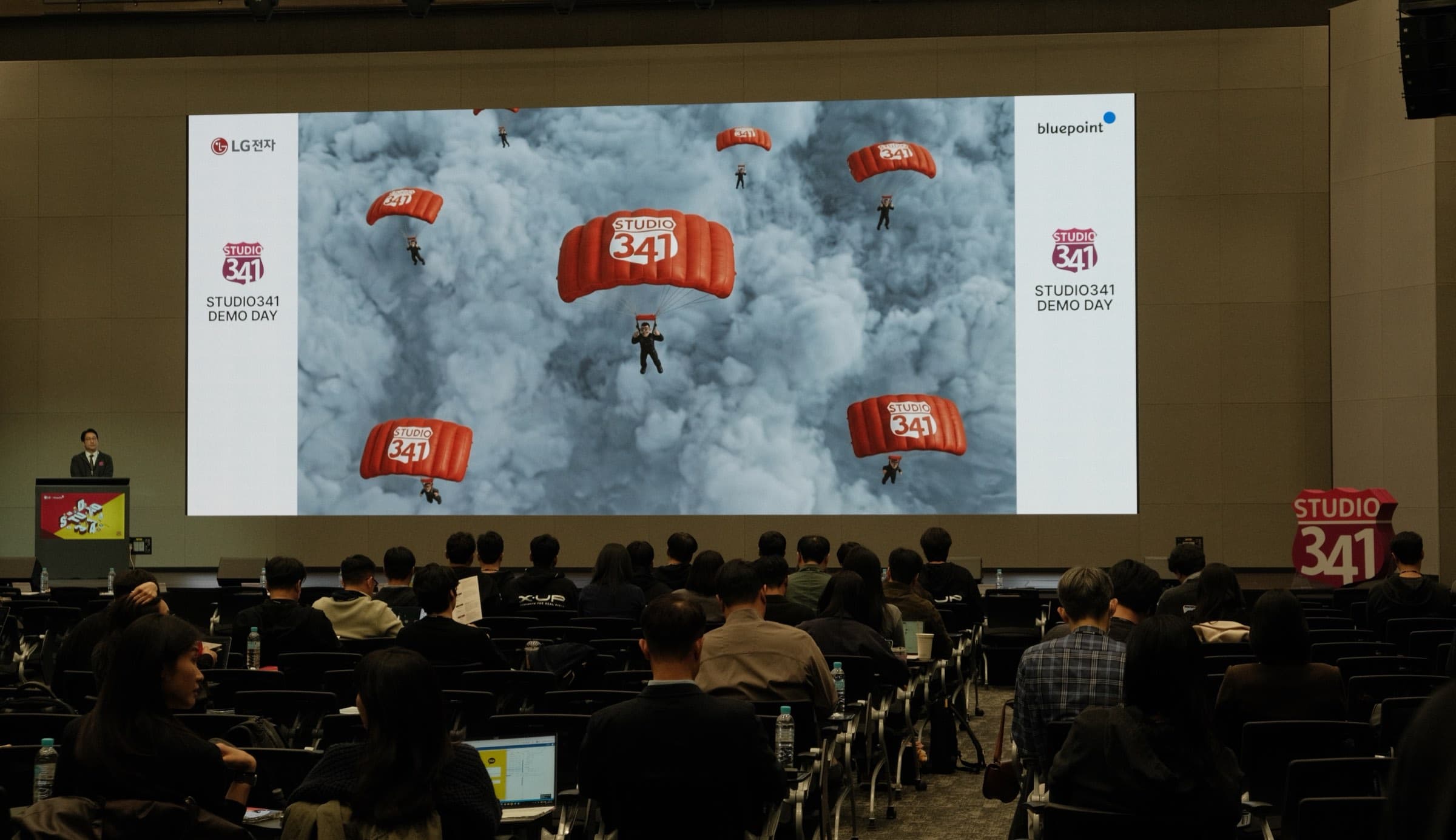 An audience watching a film we produced on a cinema screen